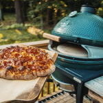 pizza going into grill